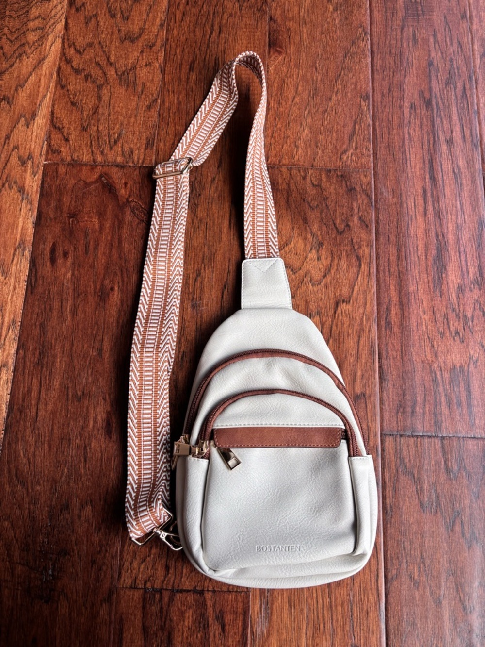 Cream Crossbody Sling Bag with Tan Trim and Patterned Strap